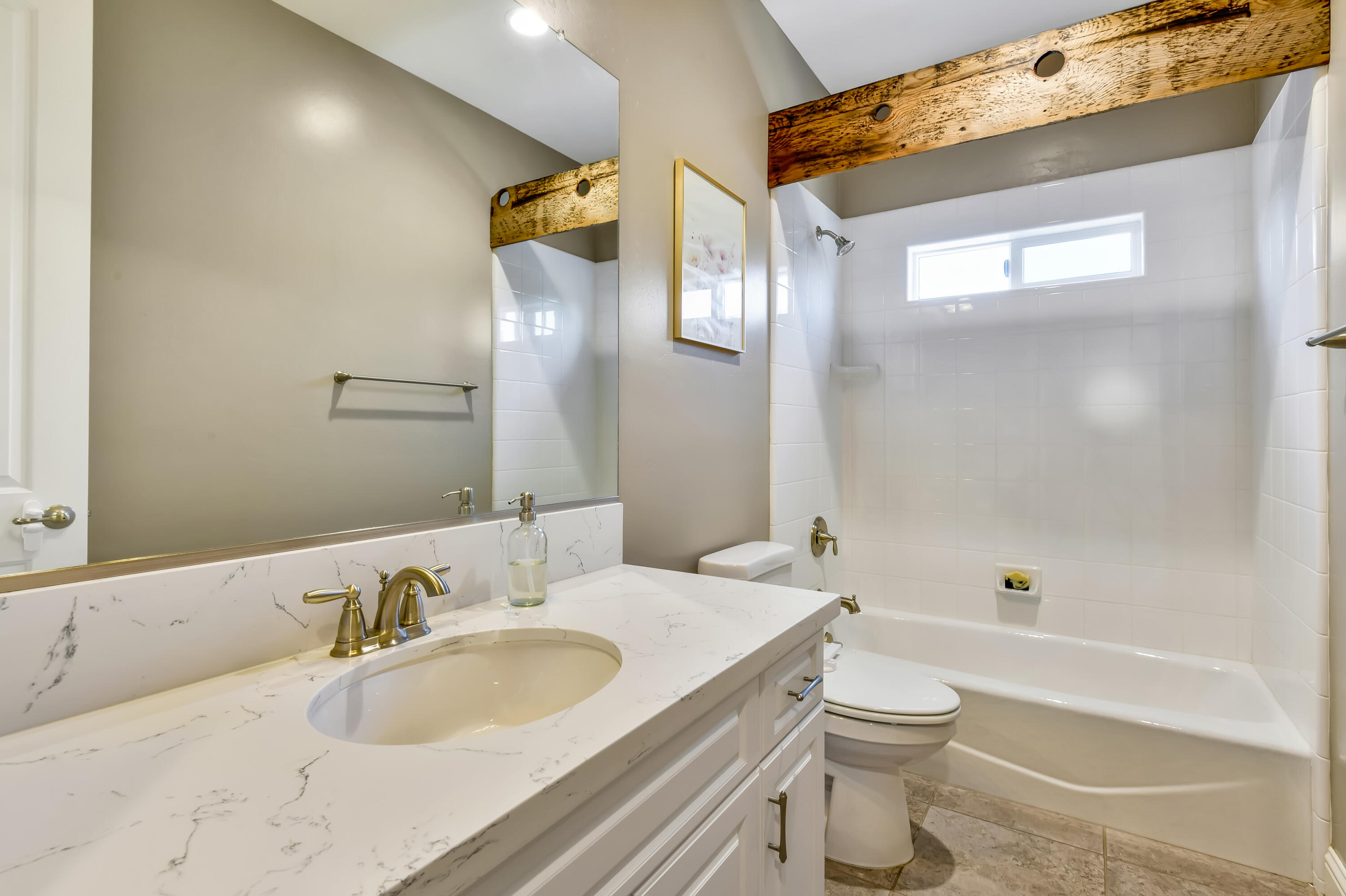 585 Valley Oak Road Solvang, CA 93463 - Photo 13 of 21 a bathroom with a granite countertop sink a toilet and shower