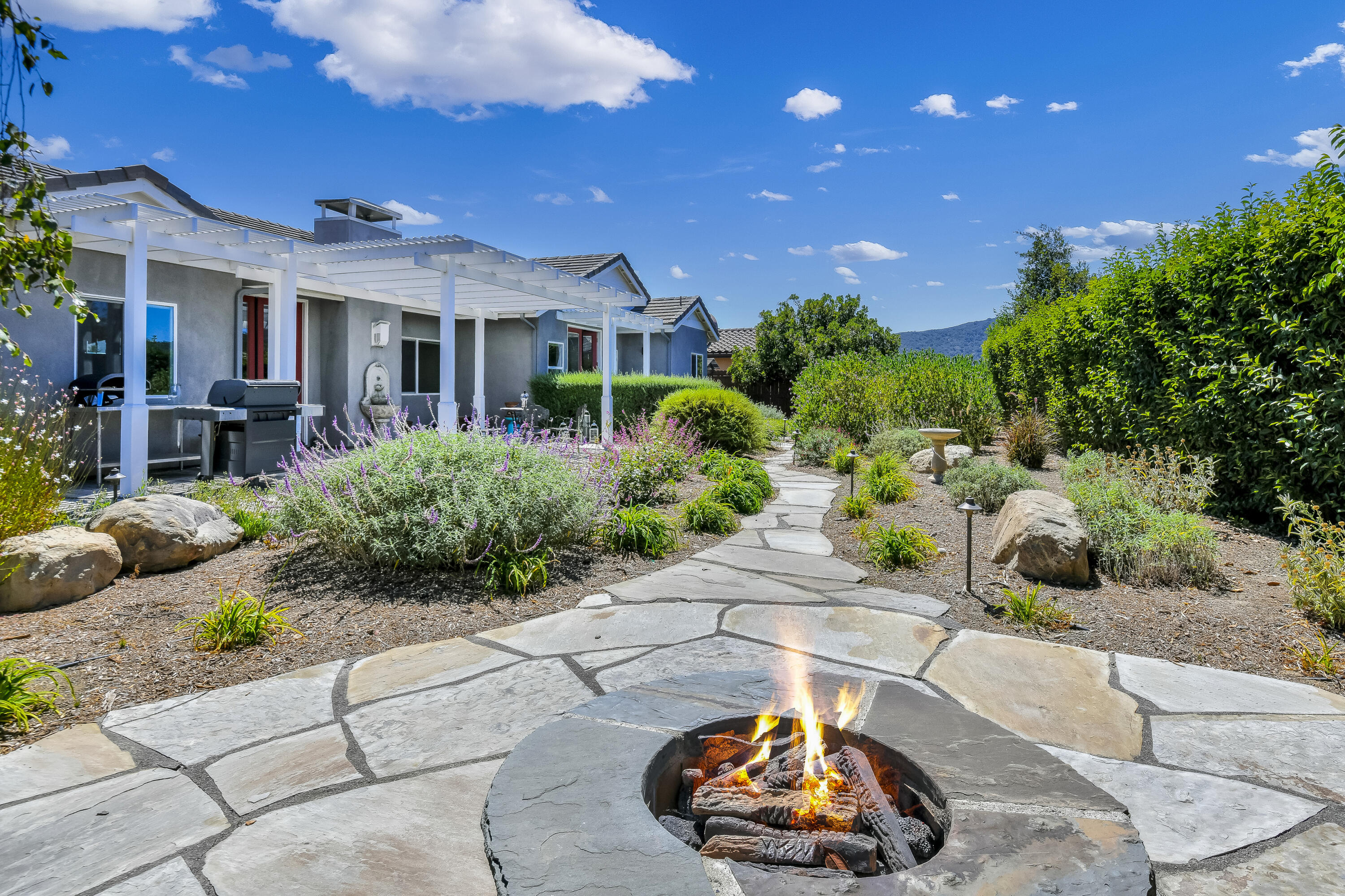 585 Valley Oak Road Solvang, CA 93463 - Photo 17 of 21 a view of a chairs and tables in patio