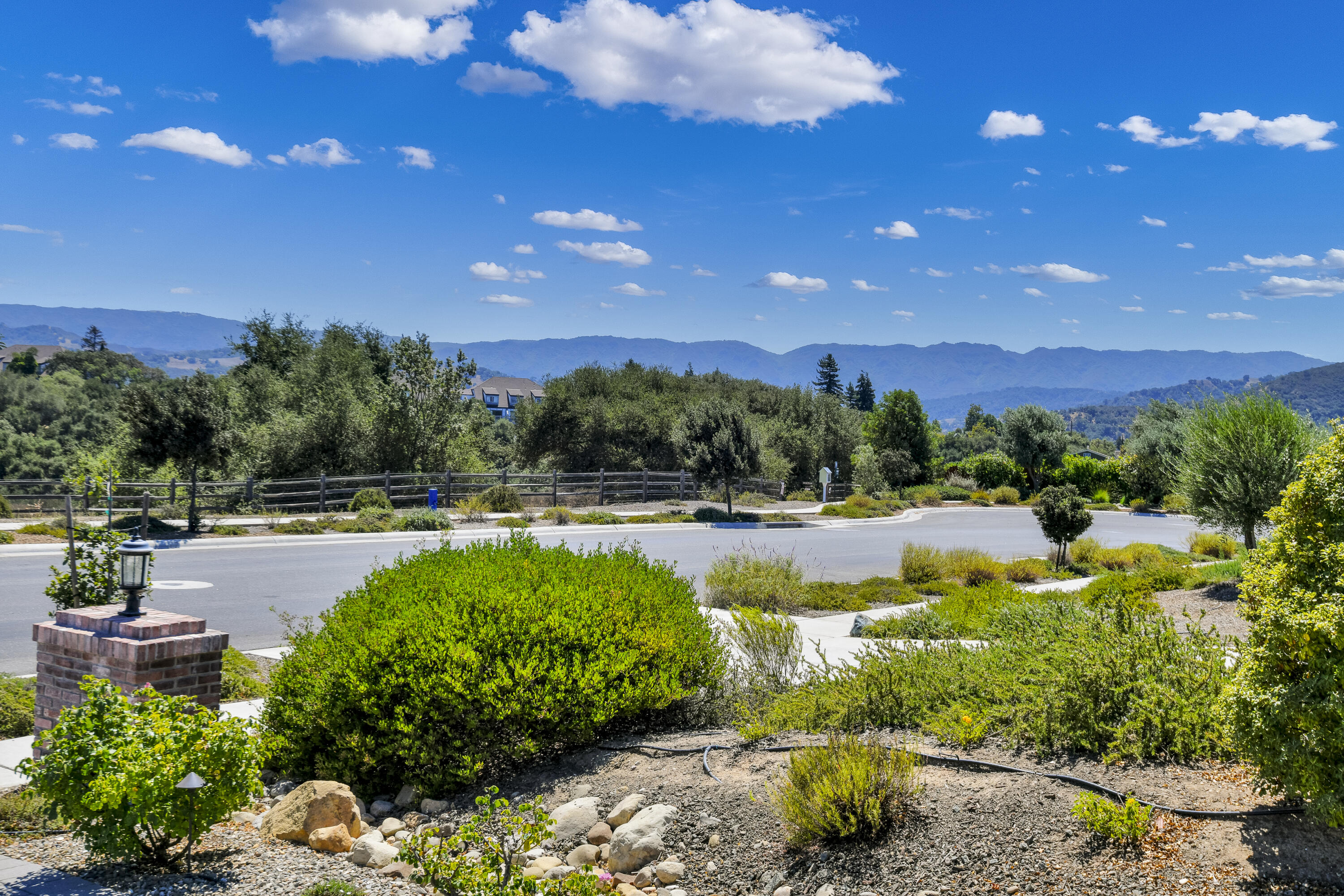 585 Valley Oak Road Solvang, CA 93463 - Photo 2 of 21 a view of a swimming pool with lawn chairs and potted plants