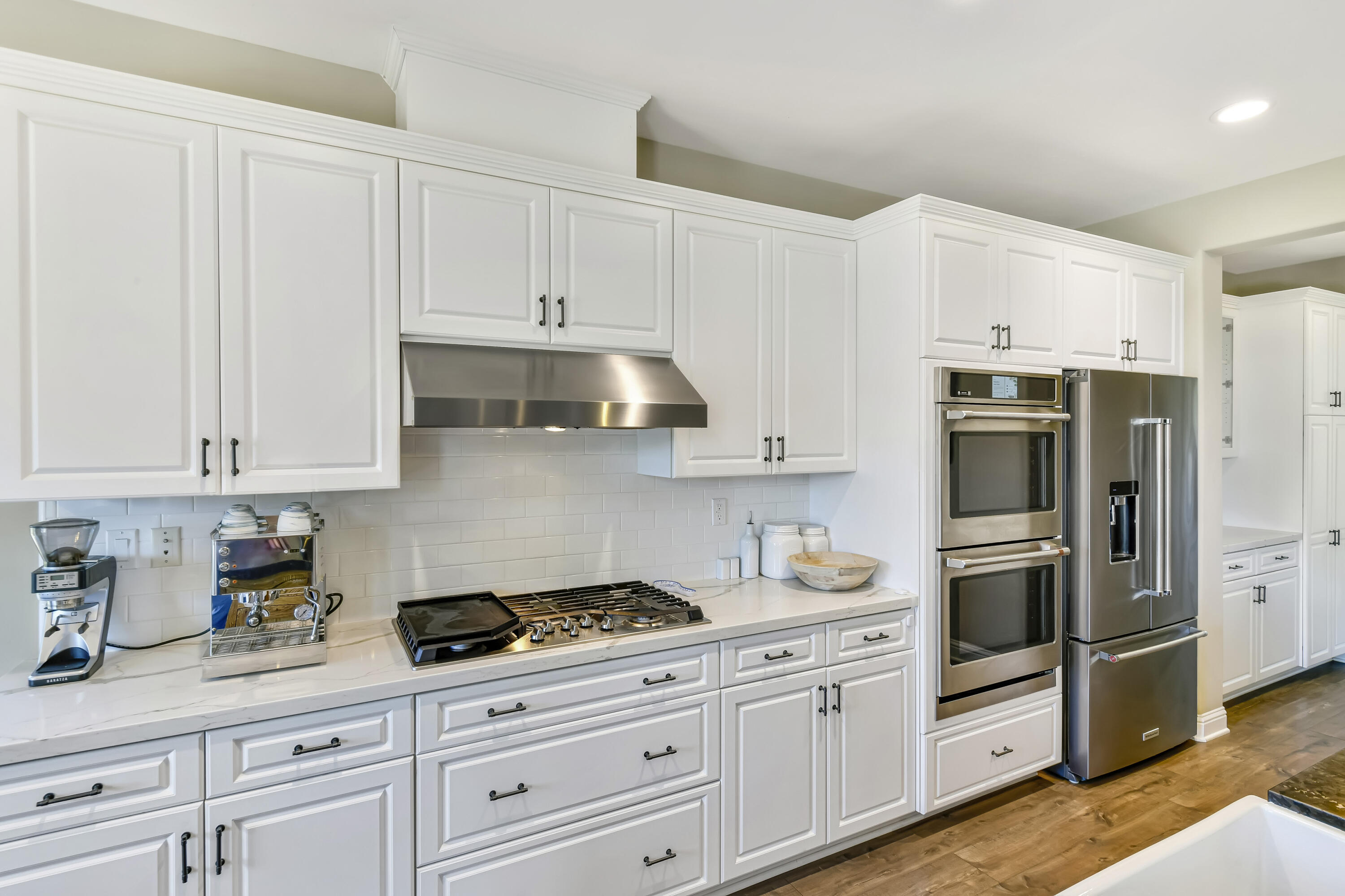 585 Valley Oak Road Solvang, CA 93463 - Photo 7 of 21 a kitchen with stainless steel appliances granite countertop white cabinets a refrigerator and a stove top oven