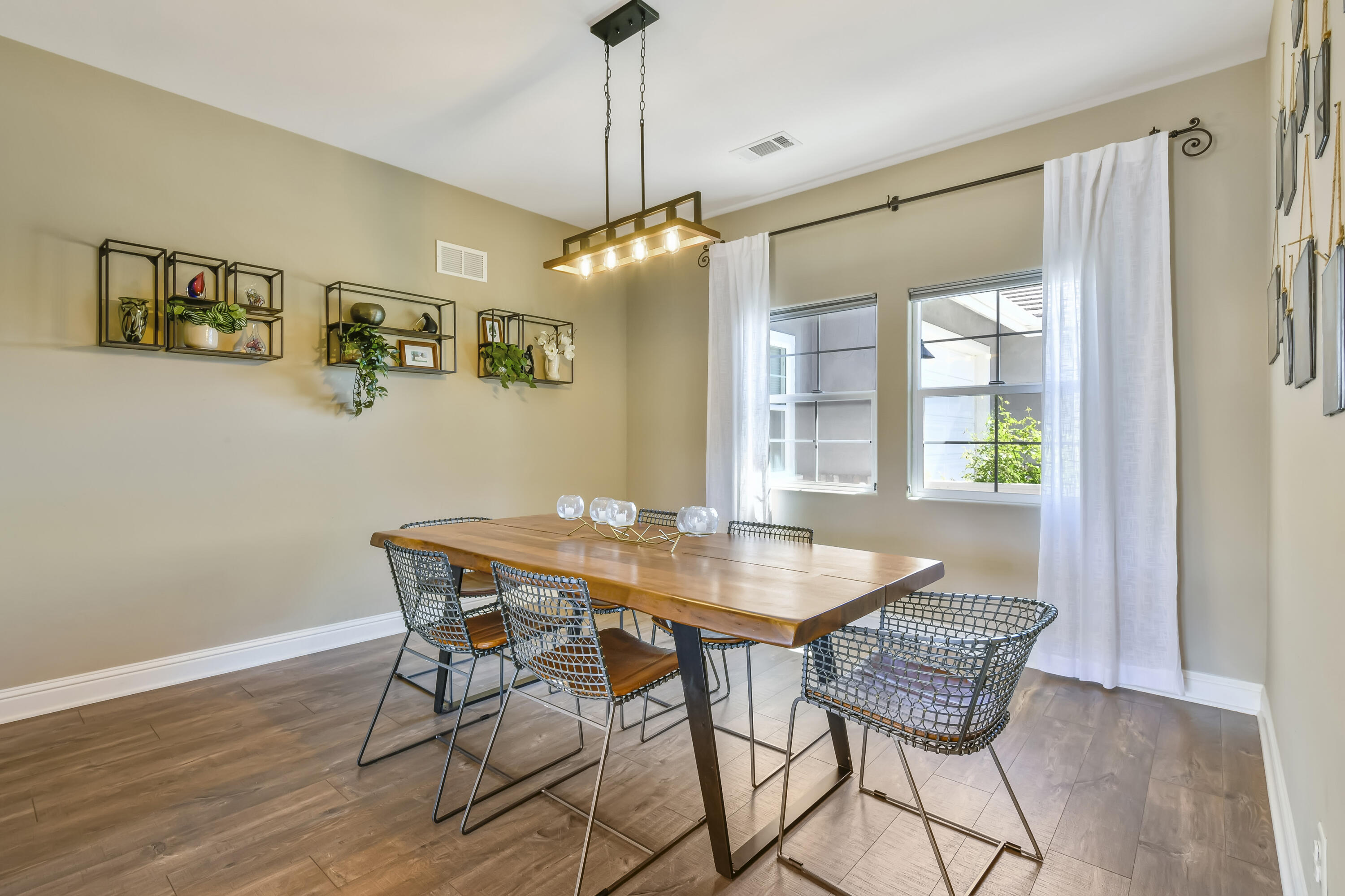 585 Valley Oak Road Solvang, CA 93463 - Photo 8 of 21 a view of a dining room with furniture window and wooden floor