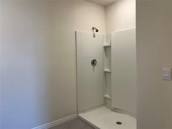 a bathroom with a shower and toilet