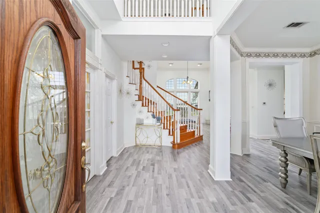 a view of entryway with wooden floor