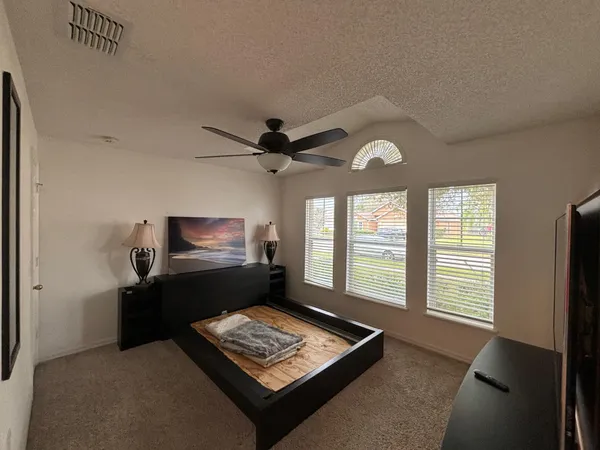 a living room with couch and a window