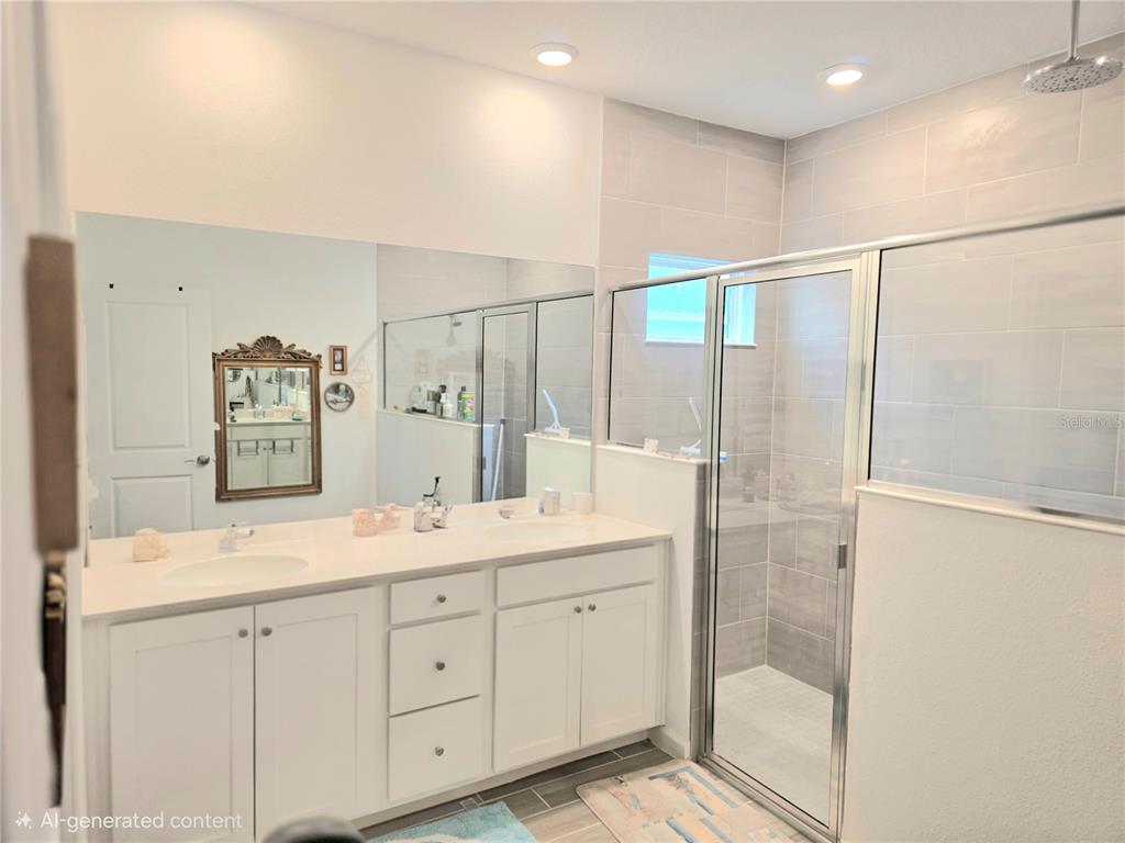 7875 Southwest 74th Street Ocala, FL 34474 - Photo 24 of 28 a spacious bathroom with a shower sink and mirror