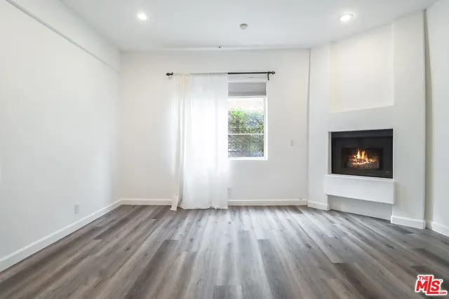 a view of parking garage with cars