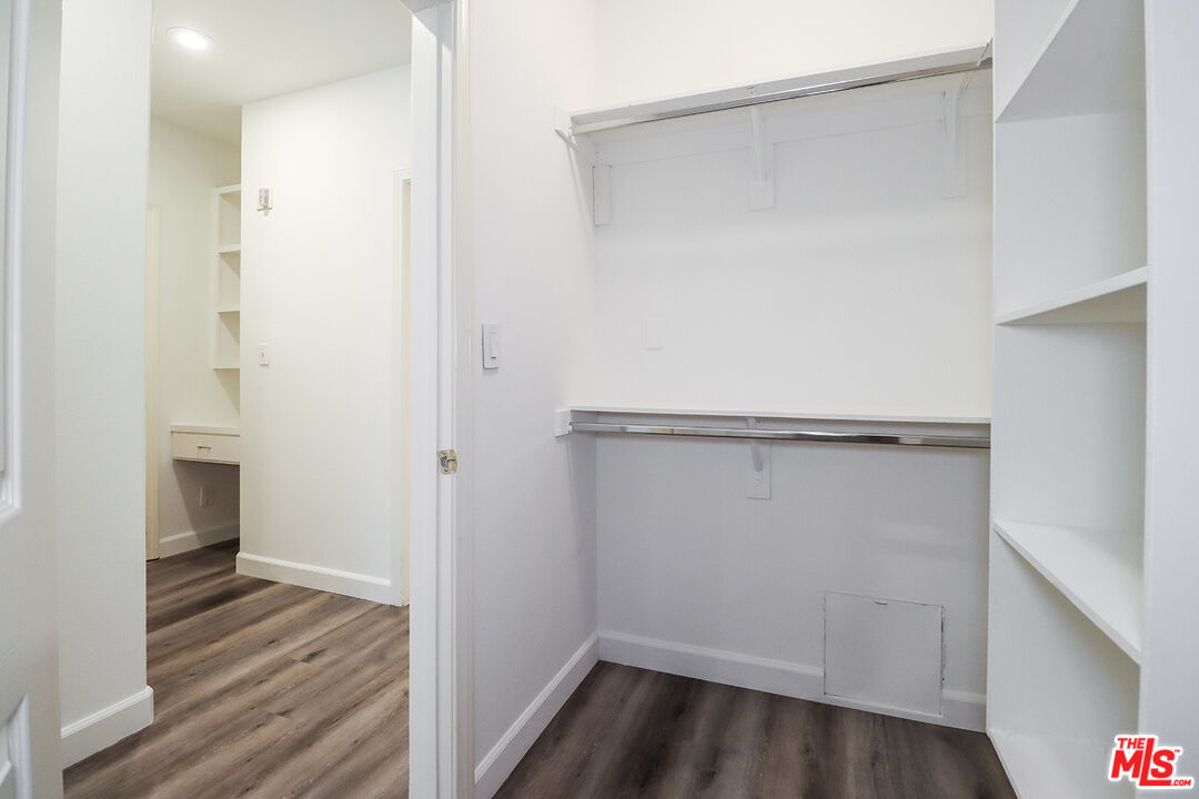 11920 Goshen Avenue, Unit 102 Los Angeles, CA 90049 - Photo 30 of 39 a view of walk in closet with wooden floor