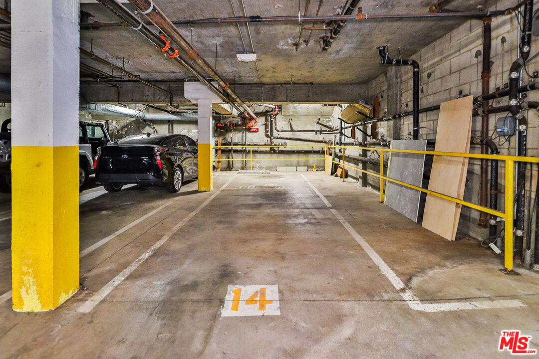 11920 Goshen Avenue, Unit 102 Los Angeles, CA 90049 - Photo 37 of 39 a view of parking garage with cars