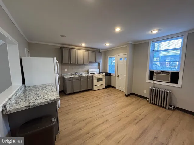 a view of kitchen with wooden floor