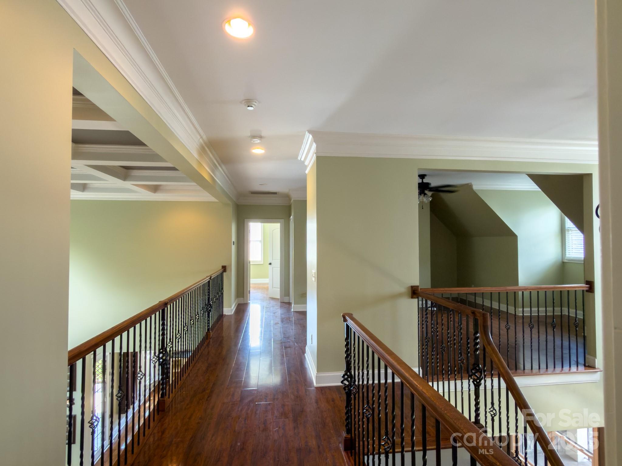 1132 Mt Holly-Huntersville Road Charlotte, NC 28214 - Photo 14 of 43 a view of a hallway with wooden floor and stairs