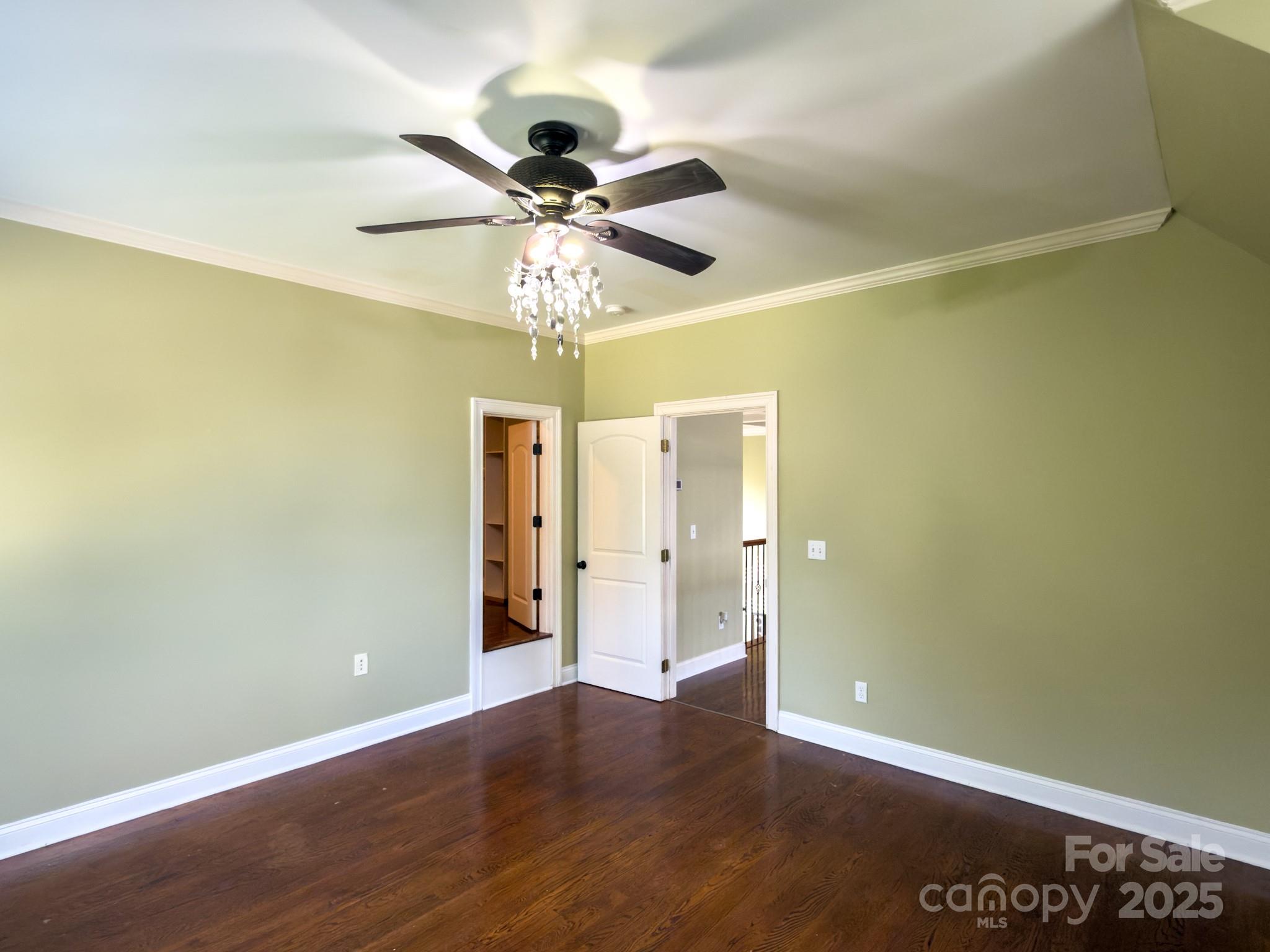 1132 Mt Holly-Huntersville Road Charlotte, NC 28214 - Photo 20 of 43 an empty room with wooden floor closet and fan