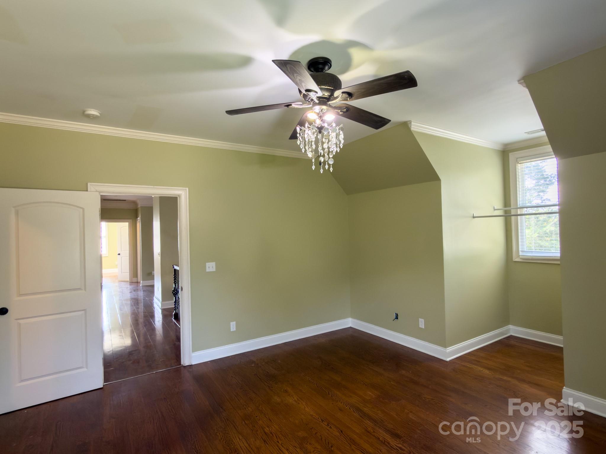 1132 Mt Holly-Huntersville Road Charlotte, NC 28214 - Photo 21 of 43 wooden floor in an empty room with a window