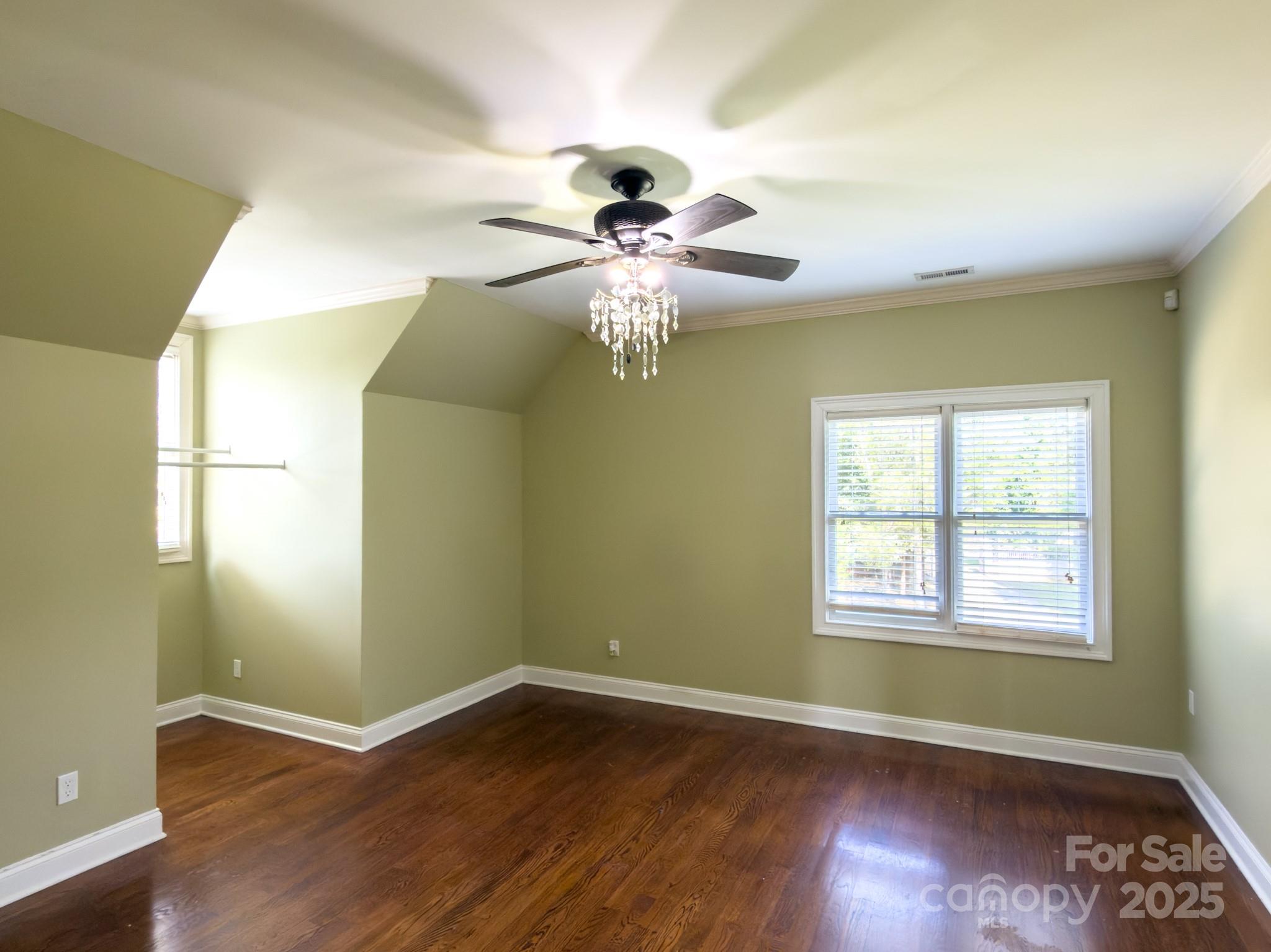 1132 Mt Holly-Huntersville Road Charlotte, NC 28214 - Photo 22 of 43 a view of an empty room with wooden floor and a window