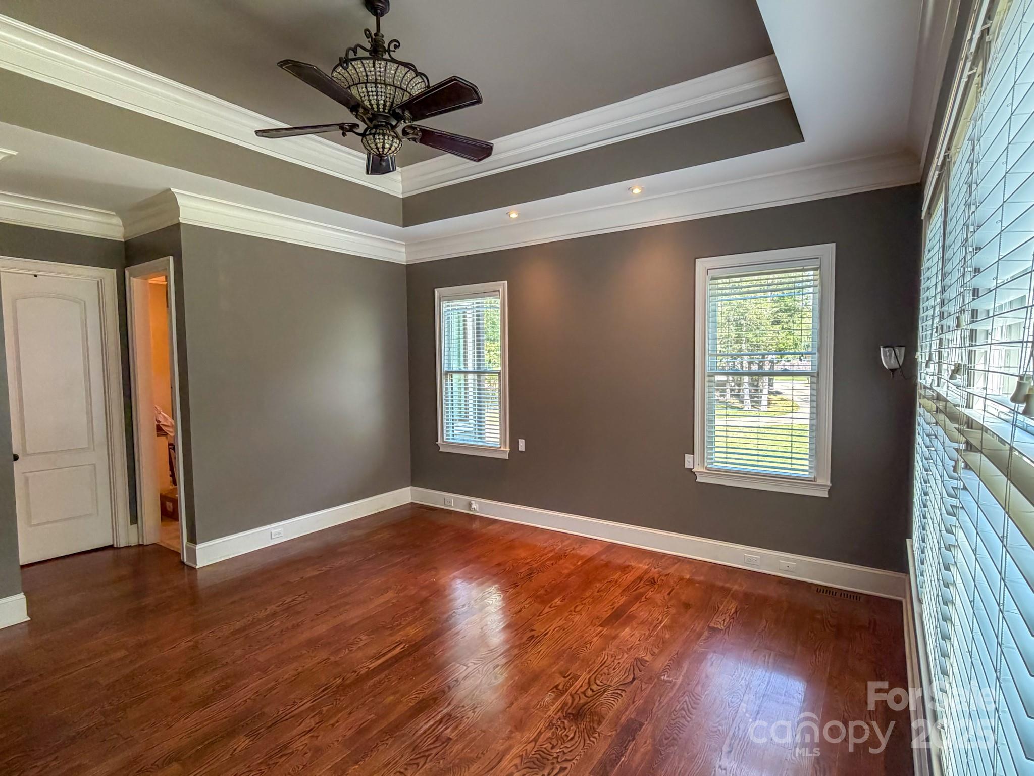 1132 Mt Holly-Huntersville Road Charlotte, NC 28214 - Photo 24 of 43 a view of an empty room with a window and wooden floor