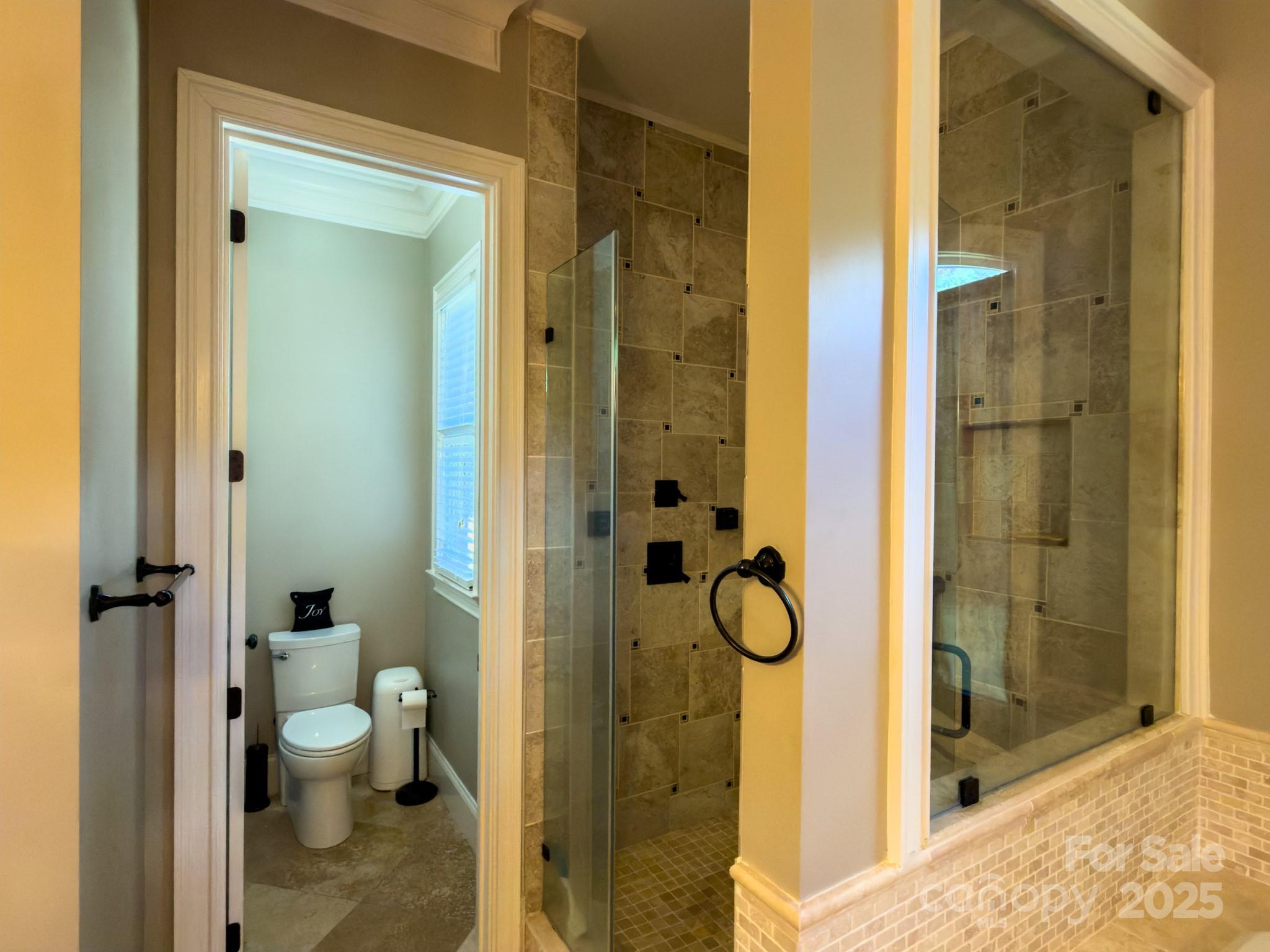 1132 Mt Holly-Huntersville Road Charlotte, NC 28214 - Photo 28 of 43 a bathroom with a granite countertop shower a toilet and a sink