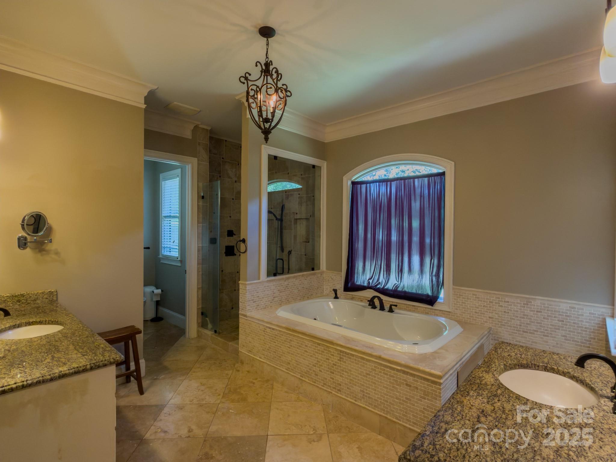 1132 Mt Holly-Huntersville Road Charlotte, NC 28214 - Photo 29 of 43 a bathroom with a tub sink and mirror