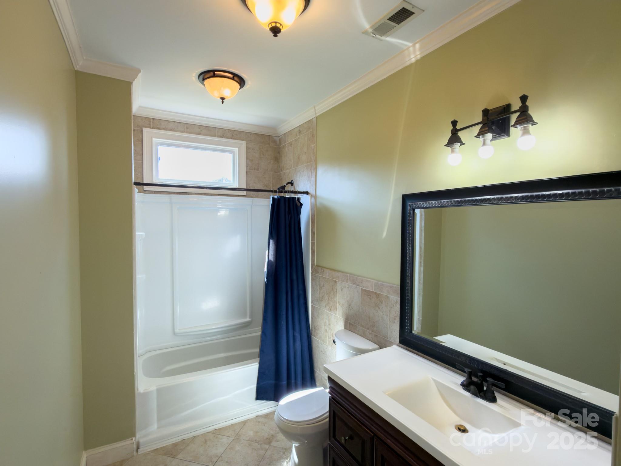 1132 Mt Holly-Huntersville Road Charlotte, NC 28214 - Photo 31 of 43 a bathroom with a sink and a mirror