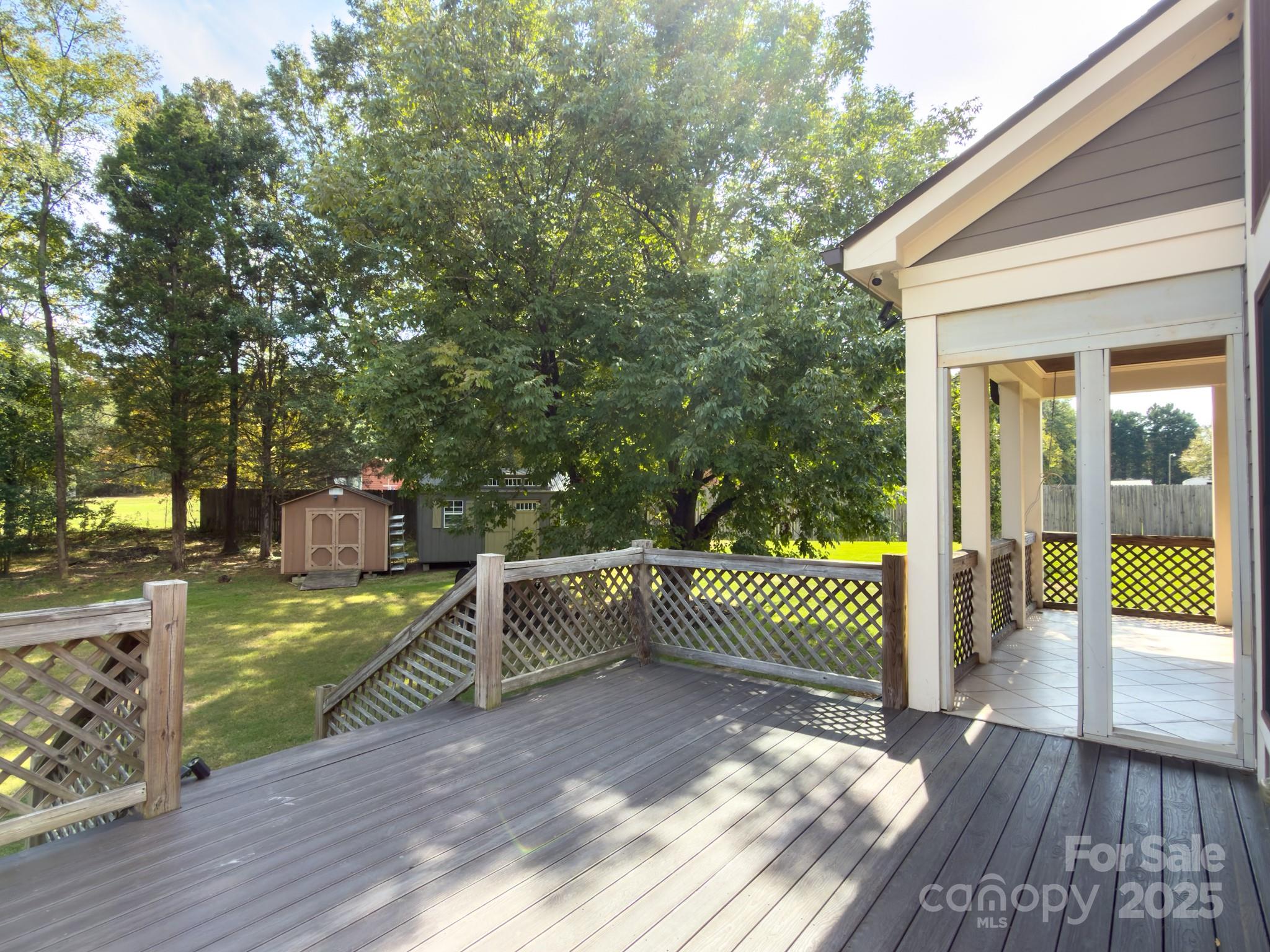 1132 Mt Holly-Huntersville Road Charlotte, NC 28214 - Photo 35 of 43 a view of a backyard with wooden floor and wooden fence