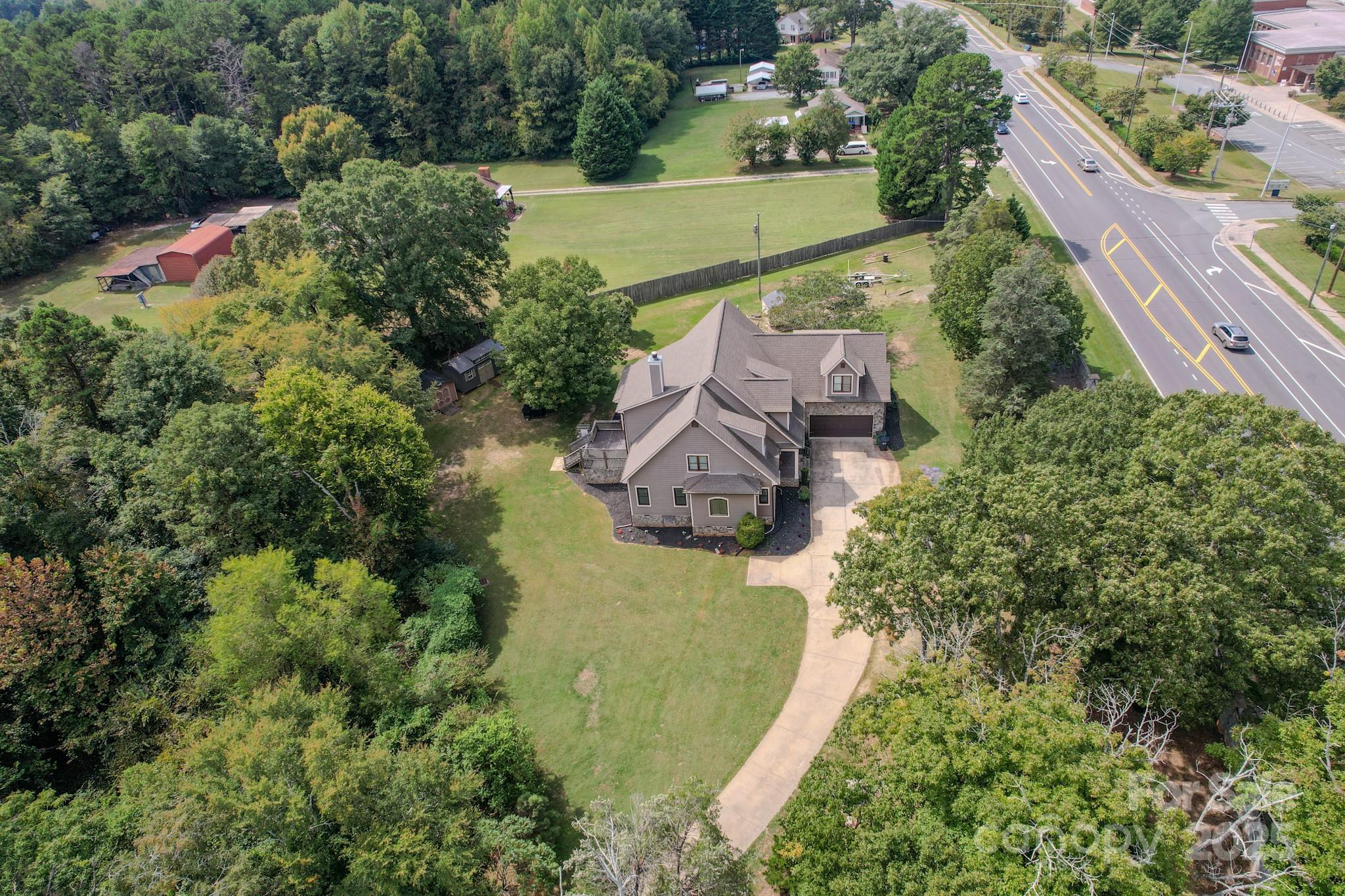 1132 Mt Holly-Huntersville Road Charlotte, NC 28214 - Photo 39 of 43 an aerial view of house with yard swimming pool and outdoor seating