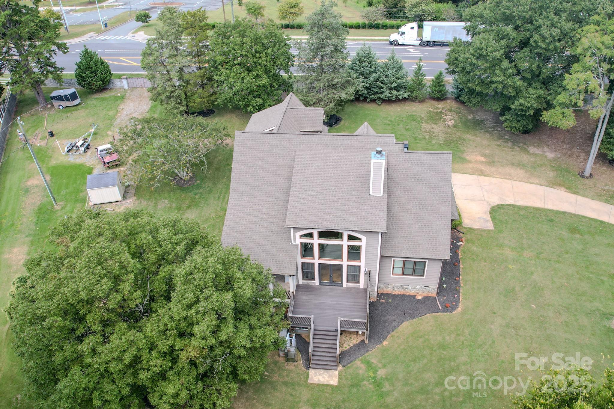 1132 Mt Holly-Huntersville Road Charlotte, NC 28214 - Photo 40 of 43 an aerial view of a house with outdoor space and lake view