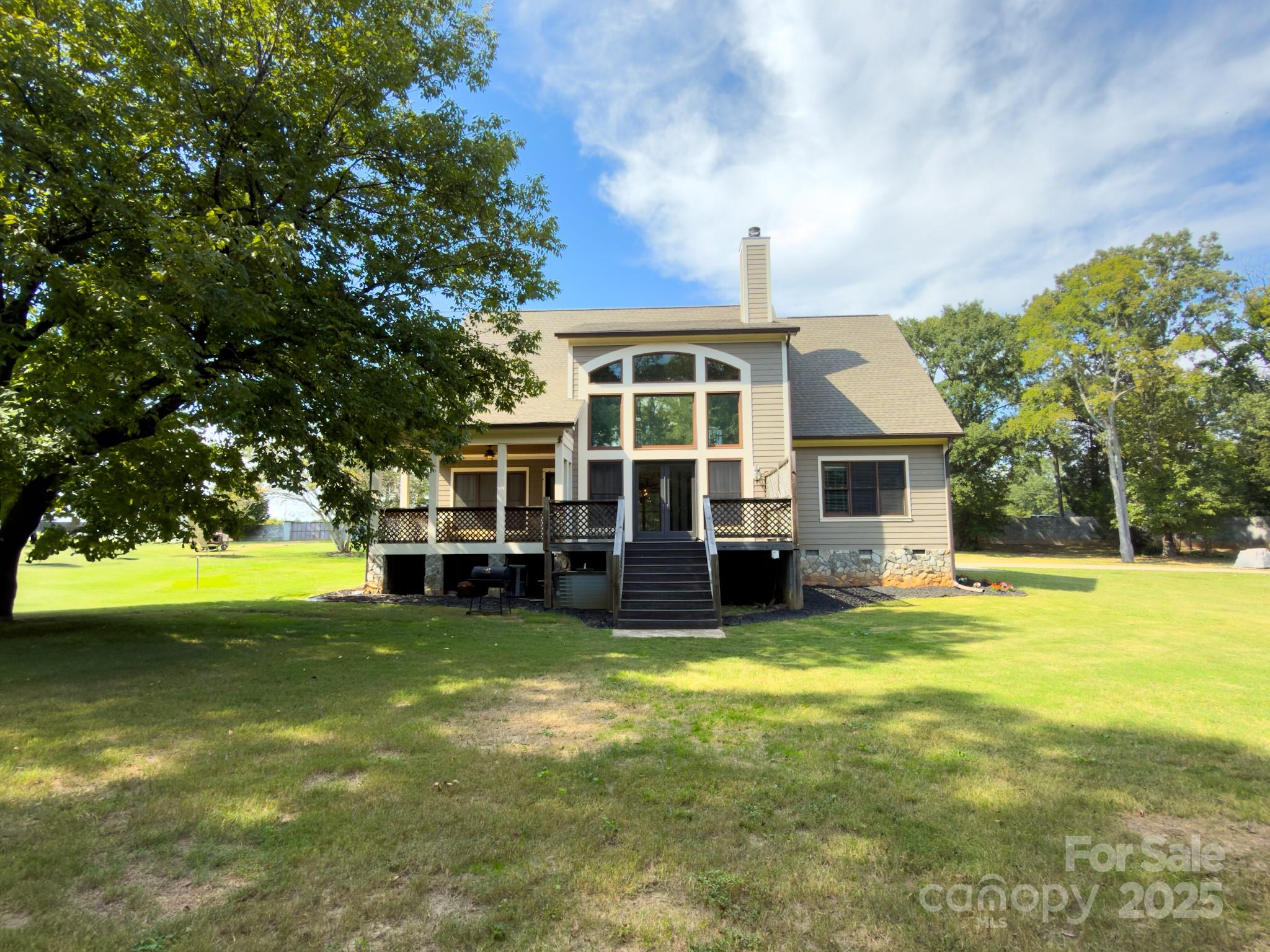 1132 Mt Holly-Huntersville Road Charlotte, NC 28214 - Photo 4 of 43 a view of a house with a big yard and large trees