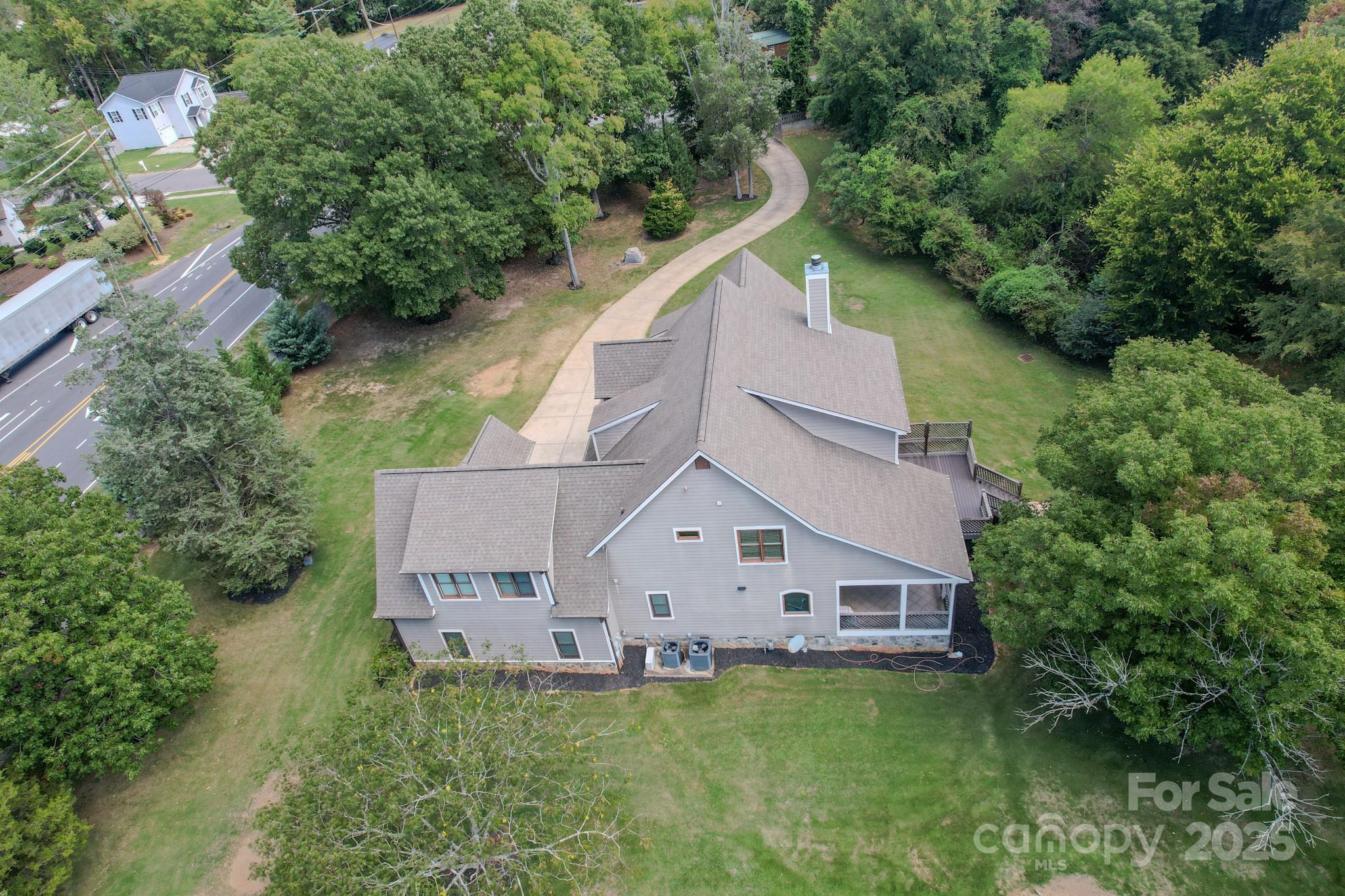 1132 Mt Holly-Huntersville Road Charlotte, NC 28214 - Photo 41 of 43 an aerial view of a house in the middle of a yard