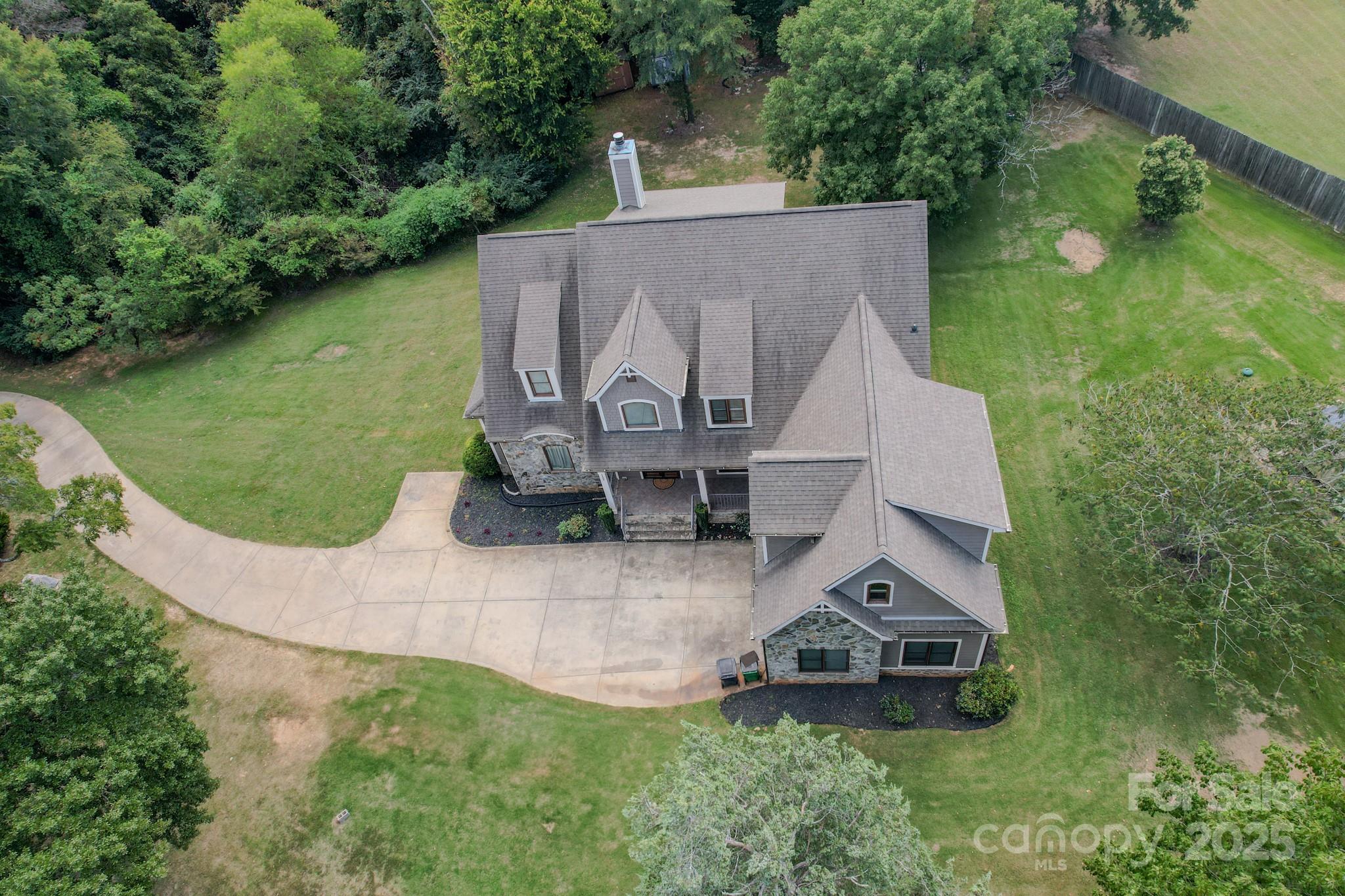 1132 Mt Holly-Huntersville Road Charlotte, NC 28214 - Photo 42 of 43 an aerial view of a house with swimming pool and big yard