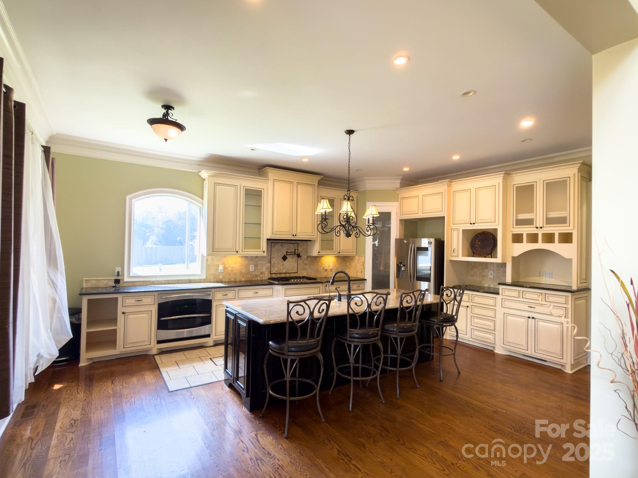 1132 Mt Holly-Huntersville Road Charlotte, NC 28214 - Photo 9 of 43 a large kitchen with a table and chairs