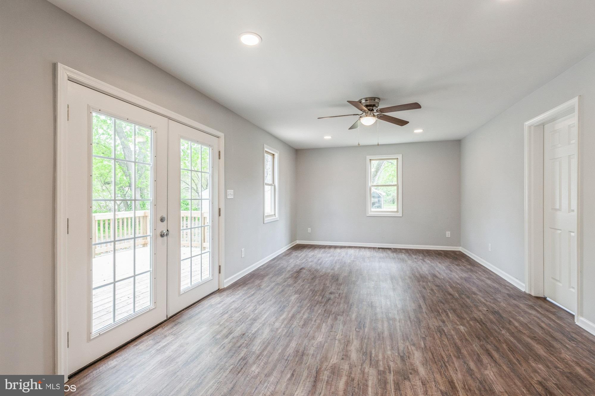 28149 Nanticoke Road Salisbury, MD 21801 - Photo 20 of 37 Living Room View of double doors leading to deck.