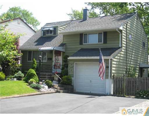 196 North Hill Road Colonia, NJ 07067 - Photo 1 of 10 a front view of a house with a garden