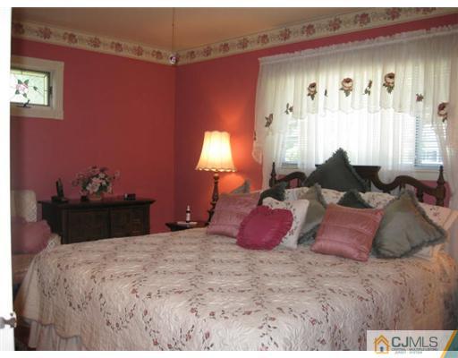 196 North Hill Road Colonia, NJ 07067 - Photo 8 of 10 a bedroom with a bed and a window
