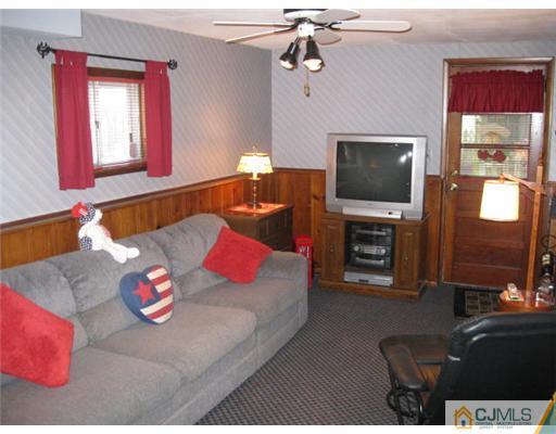196 North Hill Road Colonia, NJ 07067 - Photo 10 of 10 a living room with furniture and a flat screen tv