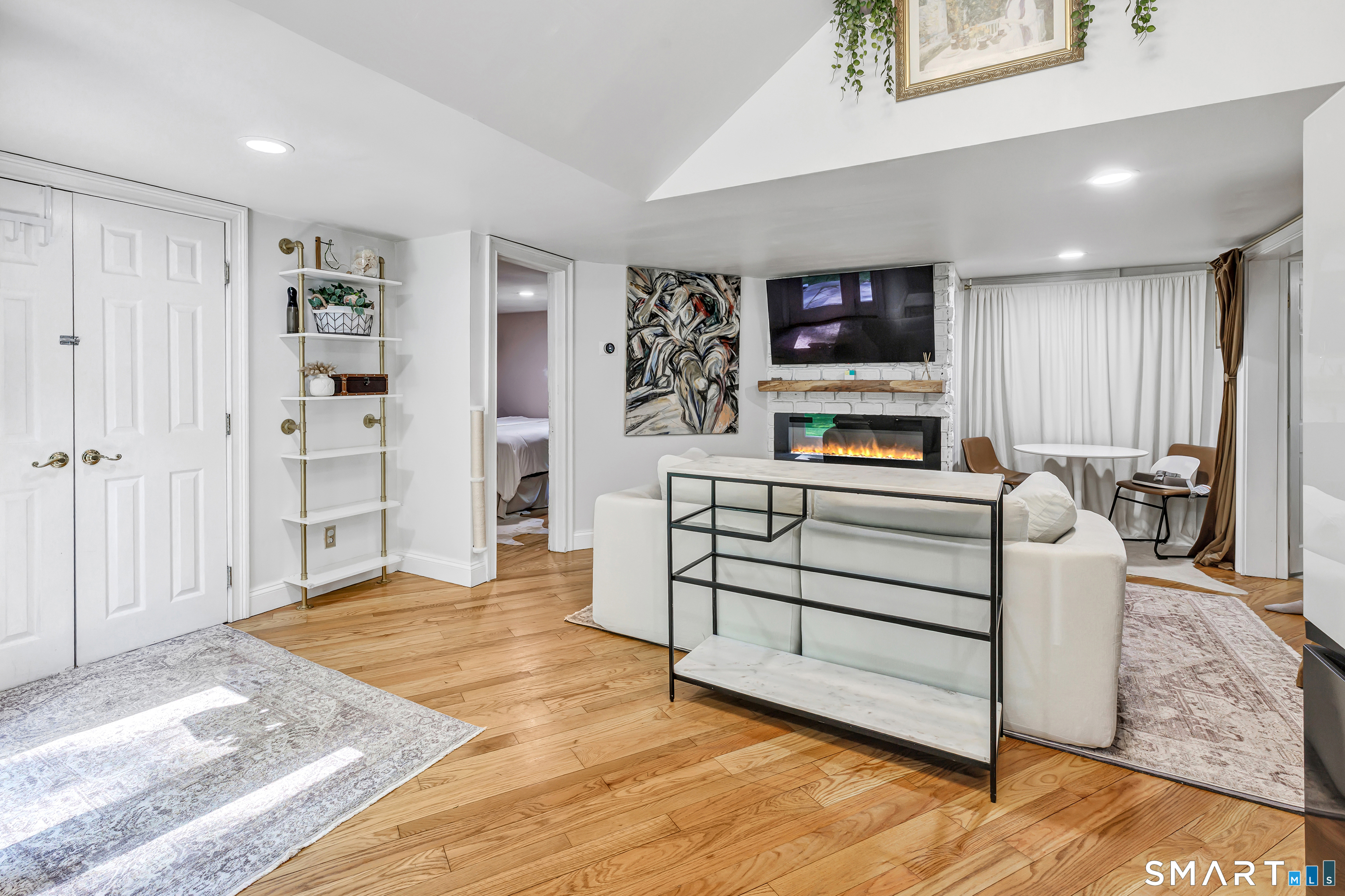 57 Olmstead Road Redding, CT 06896 - Photo 5 of 22 a living room with furniture and a flat screen tv