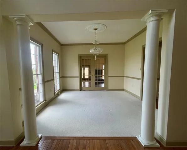a view of empty room with a fireplace