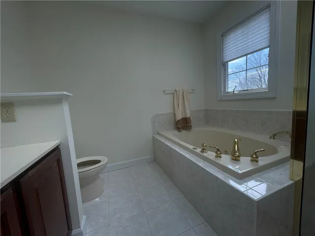 a bath tub sitting next to a toilet
