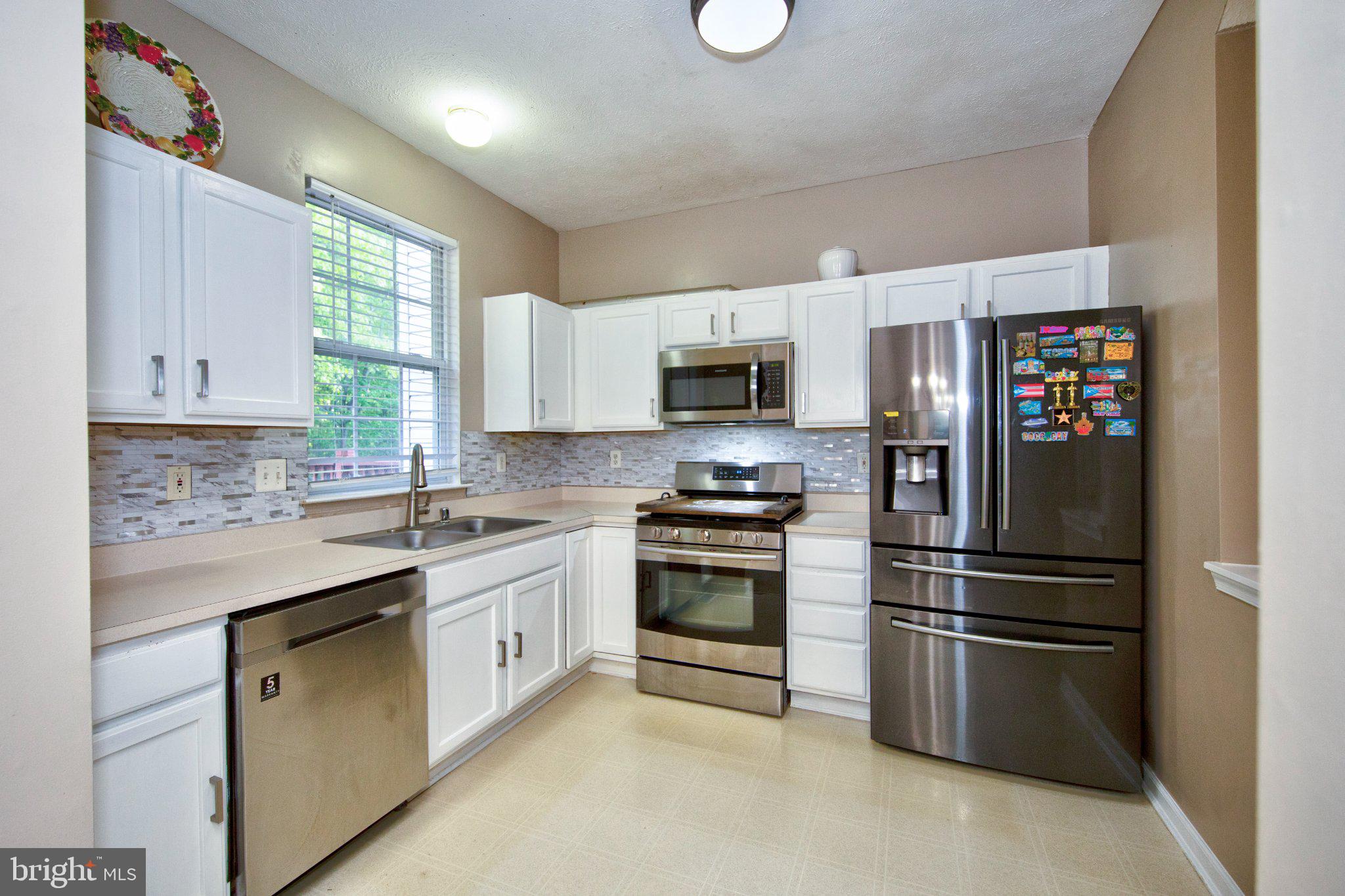 23 Caterham Court Rosedale, MD 21237 - Photo 10 of 27 Modern kitchen with sleek finishes.