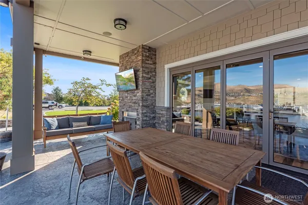 a view of a chairs and table in patio