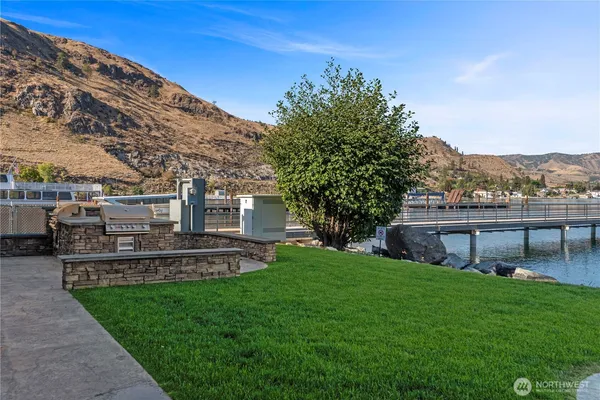 a view of a chairs and table in backyard