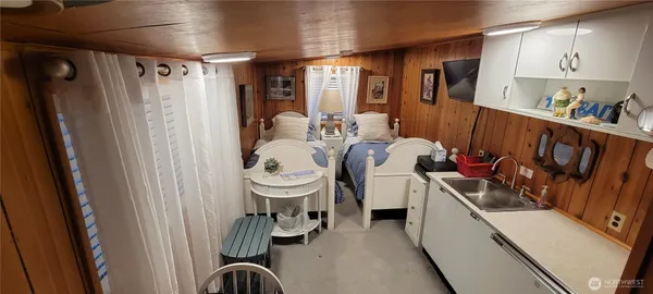 a room with furniture a rug and a window