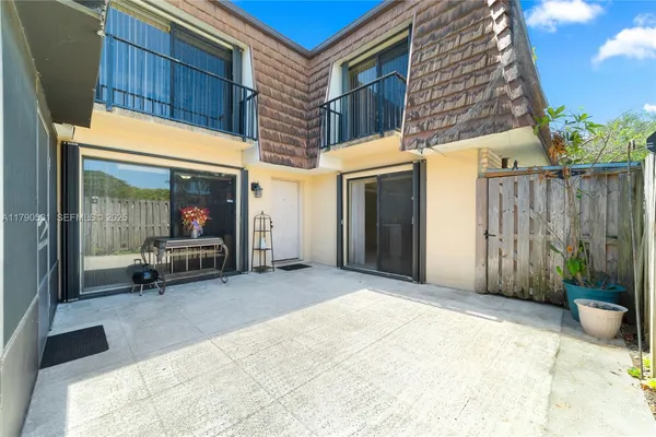 a view of a chairs with porch in front of house