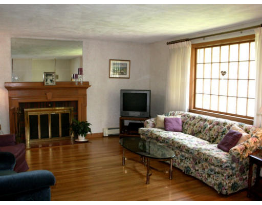 35 Colonial Drive Reading, MA 01867 - Photo 3 of 14 a living room with furniture window and a fireplace