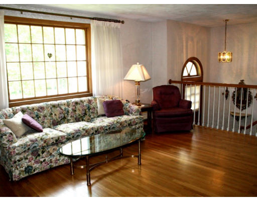 35 Colonial Drive Reading, MA 01867 - Photo 4 of 14 a living room with furniture and a large window