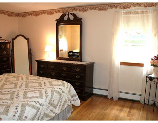 35 Colonial Drive Reading, MA 01867 - Photo 9 of 14 a bedroom with a bed and a dresser