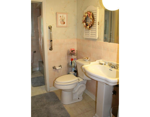 35 Colonial Drive Reading, MA 01867 - Photo 10 of 14 a bathroom with a sink and a toilet