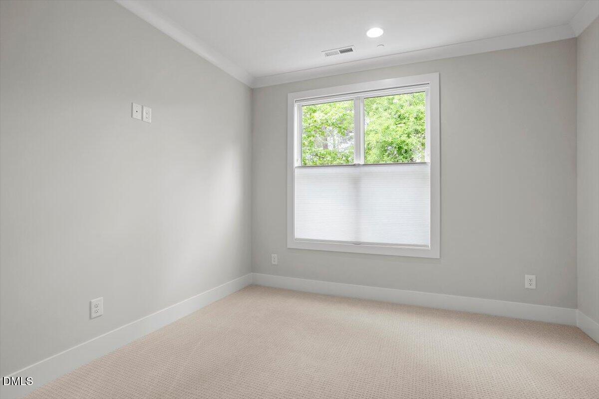 811 Maple Berry Lane, Unit 101 Raleigh, NC 27607 - Photo 31 of 45 an empty room with a window