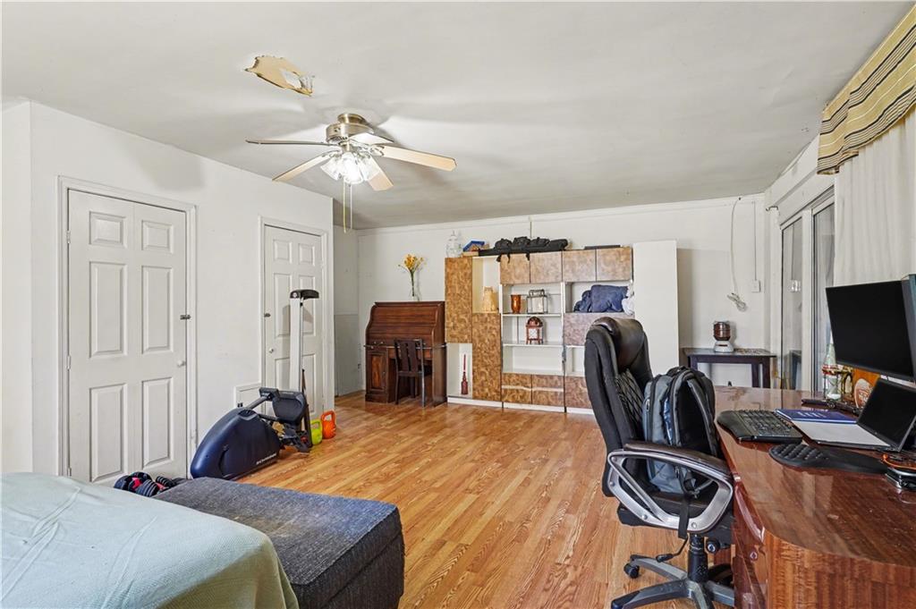 267 Macon Street Monticello, GA 31064 - Photo 12 of 28 a bedroom with a bed and a desk