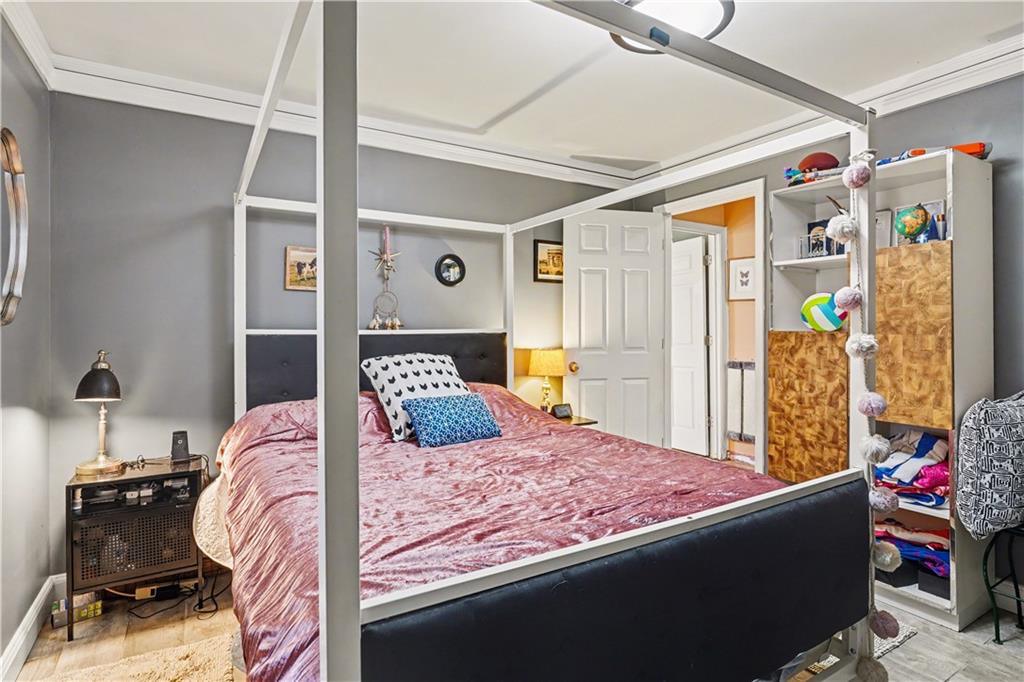 267 Macon Street Monticello, GA 31064 - Photo 15 of 28 a bedroom with a bed and a window