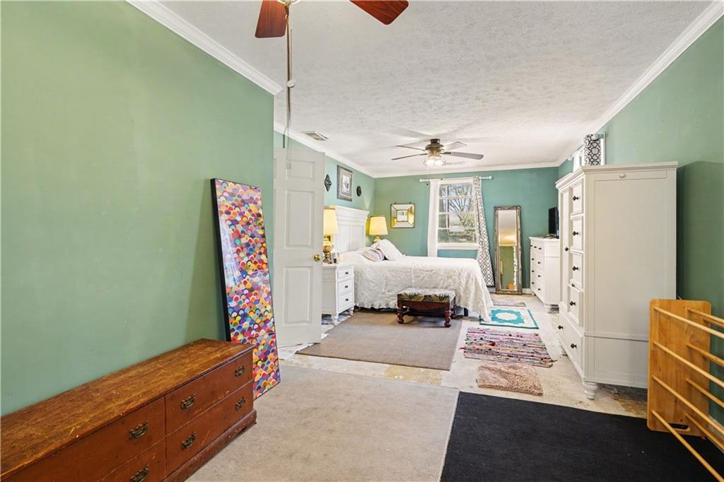 267 Macon Street Monticello, GA 31064 - Photo 20 of 28 a bedroom with bed and window