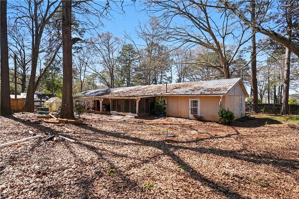 267 Macon Street Monticello, GA 31064 - Photo 2 of 28 a view of a house with a yard covered in snow
