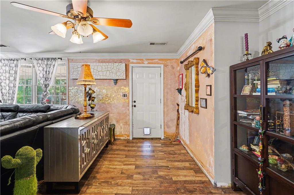267 Macon Street Monticello, GA 31064 - Photo 23 of 28 a view of a hallway to a livingroom with furniture